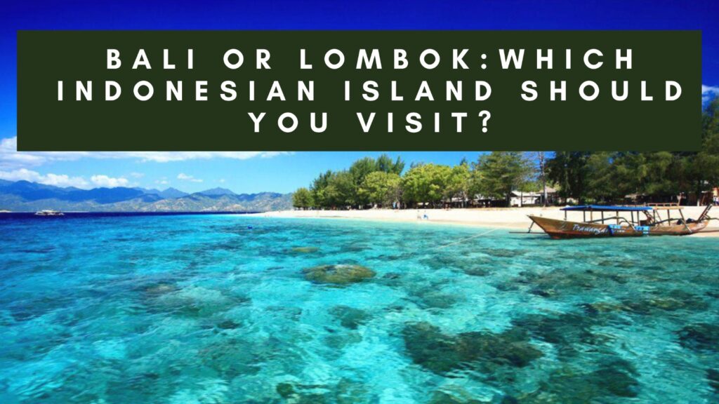 A tropical beach scene with crystal-clear turquoise waters, a sandy shore, and lush green trees. A traditional wooden boat is anchored near the shore, and mountains can be seen in the distance under a bright blue sky. The text "BALI OR LOMBOK: WHICH INDONESIAN ISLAND SHOULD YOU VISIT?" is overlaid in white on a dark green background at the top of the image