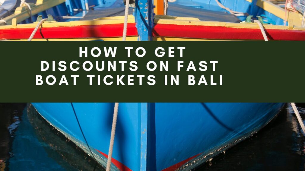 A colorful boat with a blue hull, red stripe, and yellow accents is docked in a body of water. The boat is tied up with ropes and the water reflects the sky. A banner overlaying the image reads "HOW TO GET DISCOUNTS ON FAST BOAT TICKETS IN BALI."